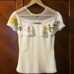 Mesh detail and stitched ruffle silk top